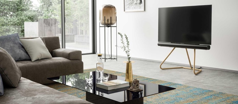 Get more out of sound with a soundbar Modern interior with a television on a TV stand integrated with a soundbar